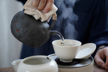 Tea wares placed on wooden shelves and tables