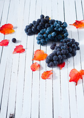 red grapes on white wood table