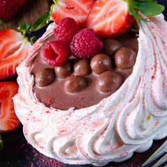 light pavlova with fresh fruits and chocolate