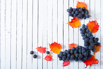 red grapes on white wood table