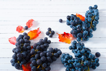 red grapes on white wood table