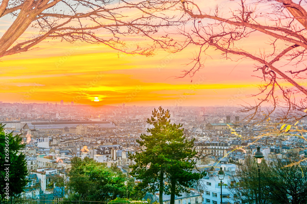 Wall mural Sunrise in Paris, France. Panorama of the city from the hill of Montmartre at sunny morning