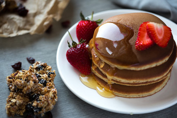 Photo of trendy asian food fluffy pancake, Japan pancake, souffle pancake with syrup and strawberry for menu, web or app using.
