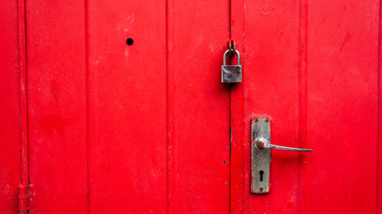 old red door with lock