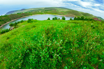 Fototapeta na wymiar View of the river from the hill through the fisheye