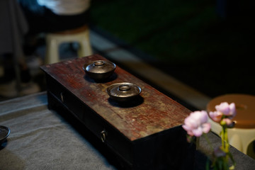 Two tea cups placed on wooden tea tables