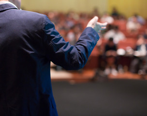 Speaker at Talk in Business Conference. Tech Executive Entrepreneur Speaker on Stage at Conference....