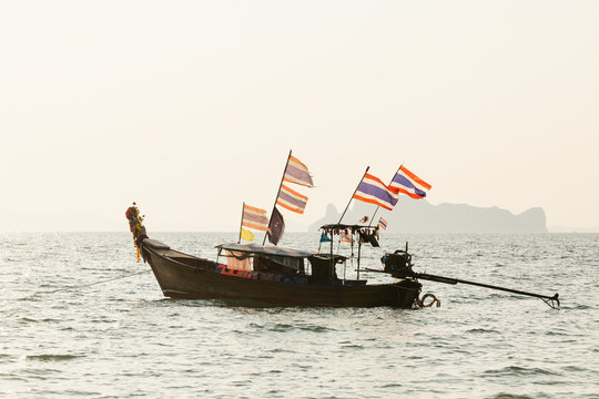 Long tail wooden boats moored at Klong Muang beach in Krabi province, Thailand