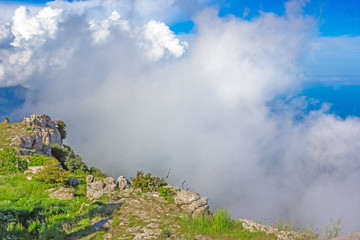Colorful summer landscape in the Crimean mountains, under a blue sky with white clouds