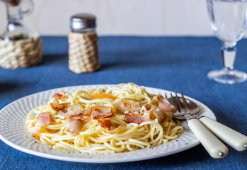 Pasta Carbonara on a blue background. Italian food
