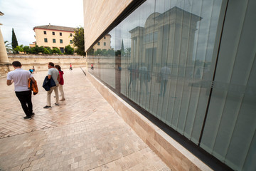 Tourist family outside visitors centre of Cordoba, Spain