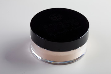 jar of face powder. Professional cosmetics. Loose powder. Tools make-up artist. Natural beige color.
