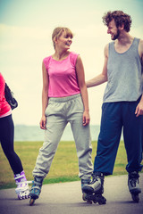 roller skater couple skating outdoor