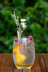 Glasses of cocktails on bar background