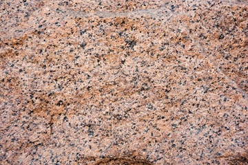 Uneven granite stone wall surface