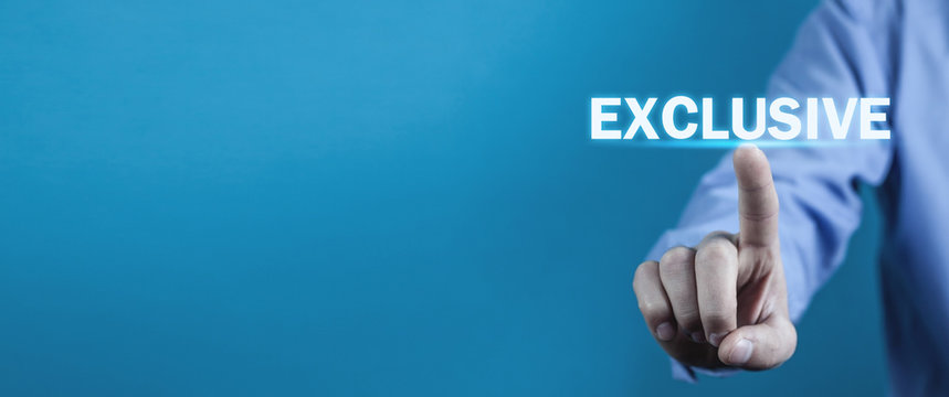 Man hand touch in Exclusive word.
