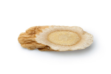 Sliced ​​of Astragalus (Huang Qi) isolated on white background, Chinese herbal medicine. Close-up.