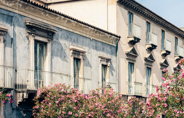 Traditional architecture of Sicily in Italy, typical street of Catania, facade of old buildings .