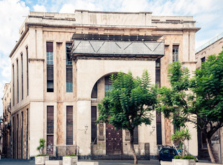 Fototapeta premium Traditional architecture of Sicily in Italy, typical street of Catania, facade of old buildings .