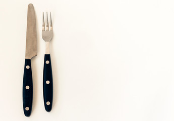 Close up knife and fork isolated on white background.