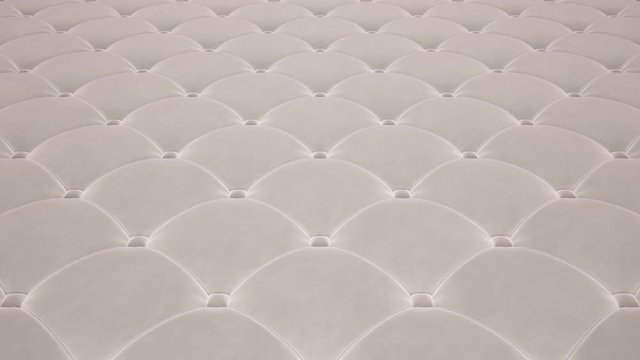 3D animation of the flight over a white quilted velvet surface. Looped video.