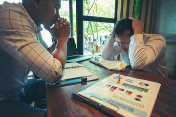 Fototapeta premium Businesspeople at business meeting making decision thinking unrecognizable businessmen sitting opposite of each other. Business negotiations with stress, motion stress.