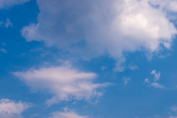 Blue sky background and white clouds soft focus, and copy space