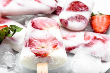 Natural juicy strawberry popsicles with yogurt. Refreshing ice pops