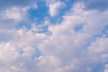 Blue sky background and white clouds soft focus, and copy space