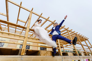 A couple in love is resting in a cafe on the beach. Newlyweds are sitting in a cafe on the beach