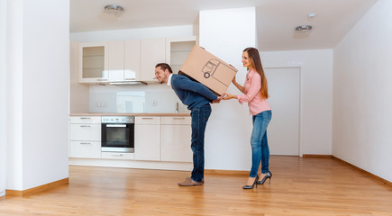 Fototapeta na wymiar Woman giving her man a moving box