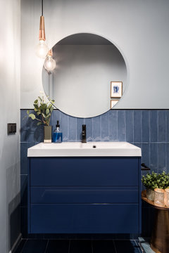 Bathroom with blue cabinet