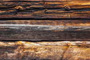 Texture of large logs of a wooden house