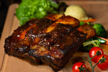 lamb ribs on dark background