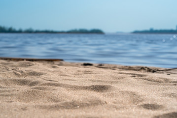 Sandy coast of the sea bay close up - summer vacation concept