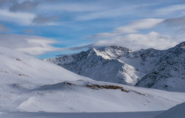 Downhill slope and apres ski mountain hut with restaurant terrace in the Italian Alps, Europe, Italy. Ski area Santa Caterina Valfurva