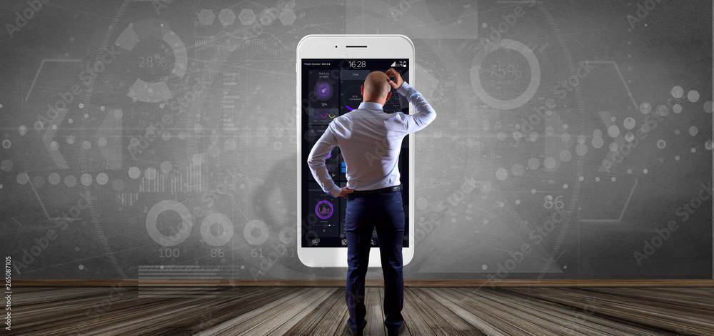 Poster businessman in front of a wall with smartphone with user interface data on the screen isolated on a 