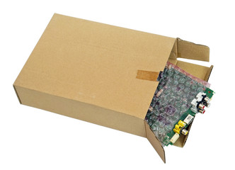 Spare parts and electronic video  components packed in soft red bug  and cardboard  box  isolated