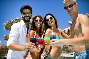 Group of friends having fun on summer vacation. Lifestyle, friendship, travel and holidays concept