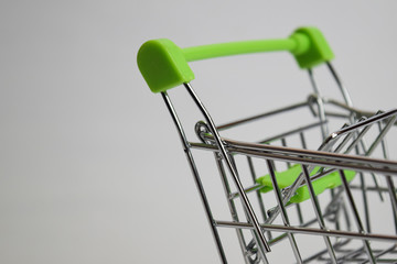 Fototapeta na wymiar Close up shopping cart, shopping trolley isolated on white background