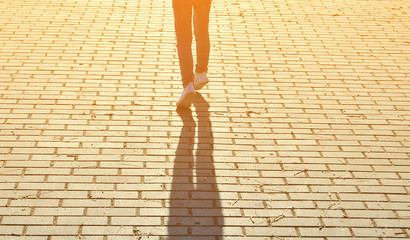 Child's foot at sunset.