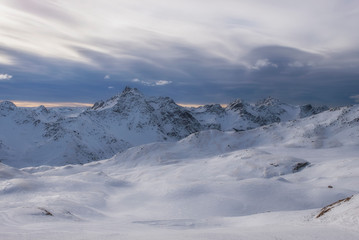 Fototapeta premium Downhill slope and apres ski mountain hut with restaurant terrace in the Italian Alps, Europe, Italy. Ski area Santa Caterina Valfurva