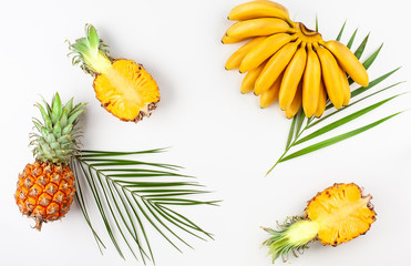 Summer composition with exotic fruits on white background.