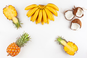 Summer composition with exotic fruits on white background.