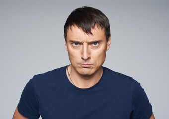 Portrait of angry man looking furious