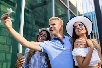 Consumerism, love, dating, travel concept. Happy couple enjoying shopping having fun