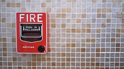 Emergency of Fire alarm or alert or bell warning equipment in red color in the building for safety.