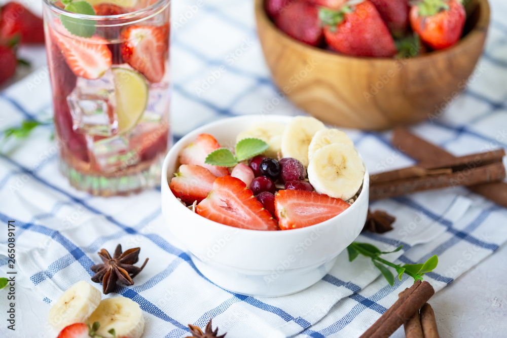 Wall mural healthy breakfast muesli with banana strawberries and berries