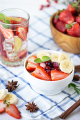 Healthy breakfast muesli with banana strawberries and berries