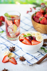 Healthy breakfast muesli with banana strawberries and berries